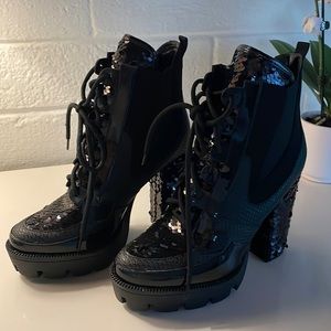 Platform boots. Size 6.5. Black with patent leather and sequin heel detail.